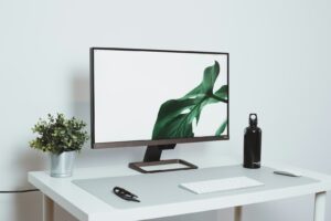 Clean modern desk setup with monitor and organized workspace